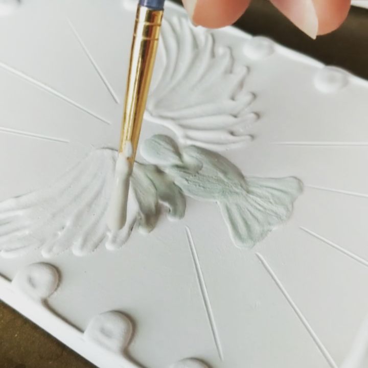Holy water fonts being glazed with wax resist